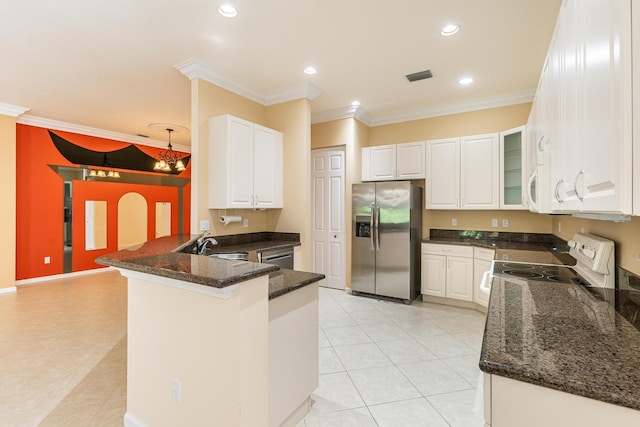 kitchen featuring light tile patterned floors, white appliances, ornamental molding, and a peninsula