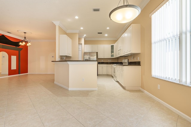 kitchen with crown molding, stainless steel fridge, dark countertops, and electric range