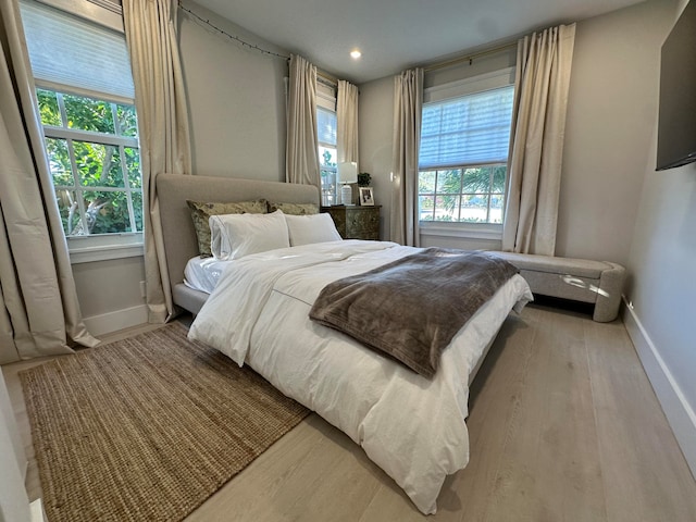 bedroom with light hardwood / wood-style floors