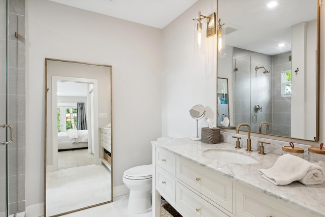 bathroom with tile patterned floors, vanity, toilet, and walk in shower