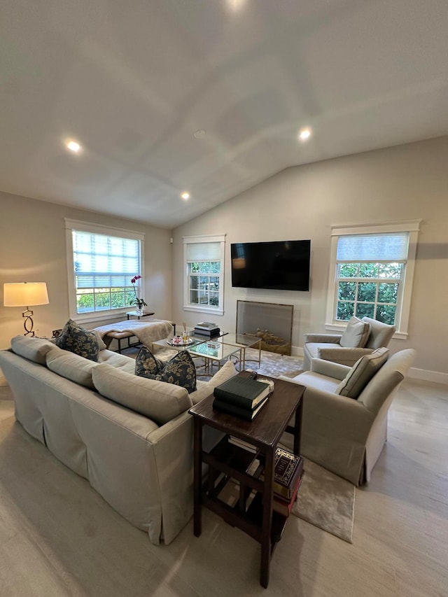 living room with light colored carpet and lofted ceiling