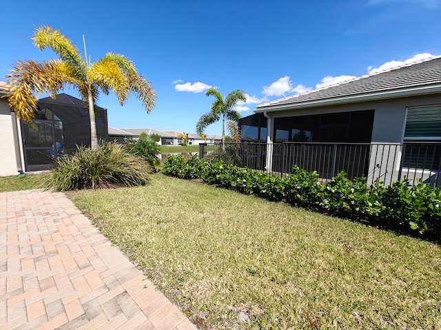 view of yard featuring a lanai