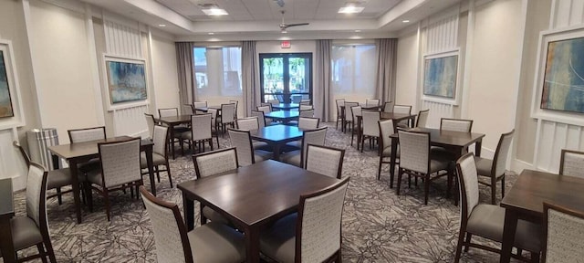 dining area with a tray ceiling