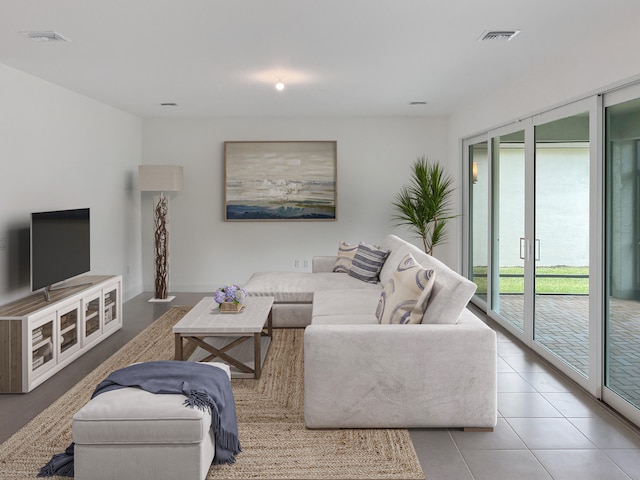 living room with light tile patterned floors