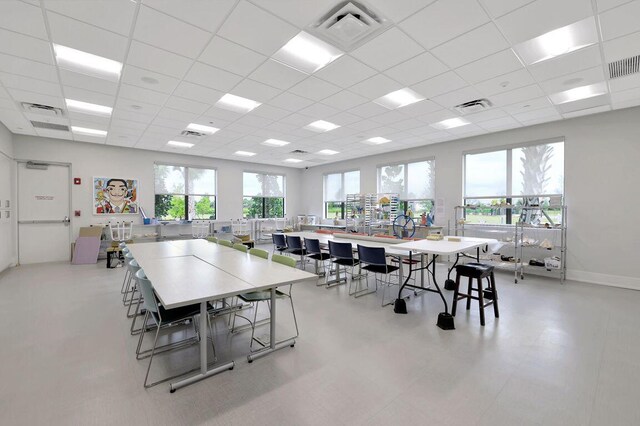 dining area with a paneled ceiling