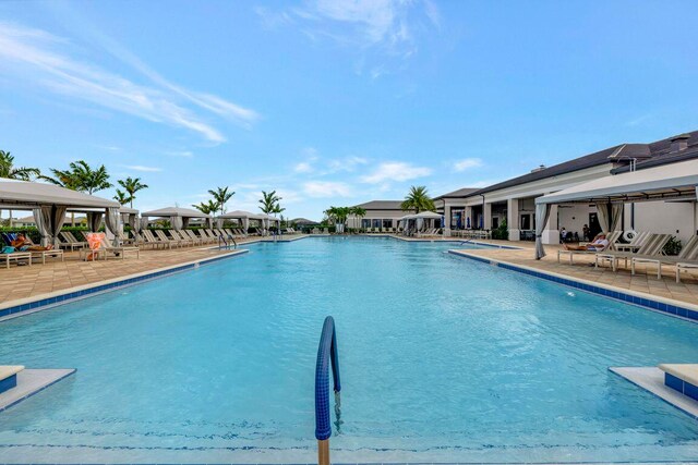 view of swimming pool featuring a patio area