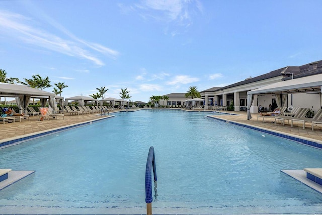 pool with a gazebo and a patio