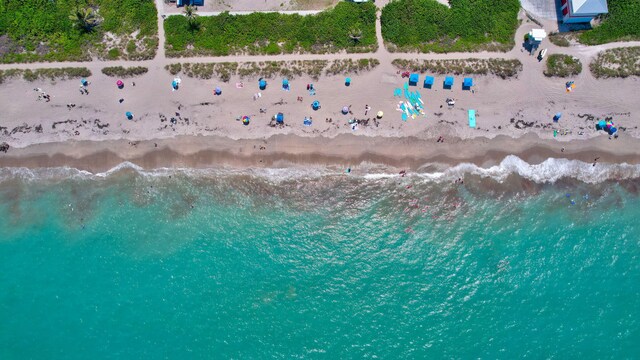 aerial view featuring a water view and a beach view