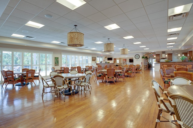 dining room featuring light wood-type flooring and visible vents