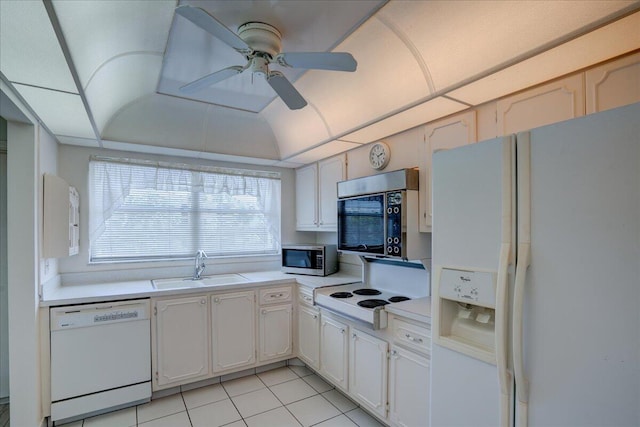 kitchen featuring white appliances, ceiling fan, light countertops, white cabinetry, and a sink