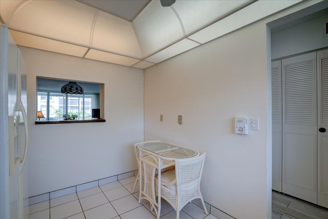 dining space featuring light tile patterned flooring and visible vents