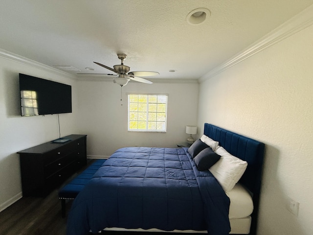 bedroom with crown molding, dark hardwood / wood-style floors, a textured ceiling, and ceiling fan