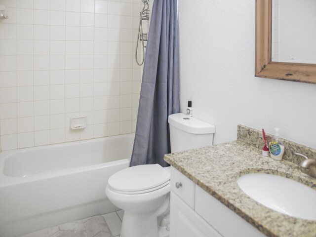 bathroom featuring a shower with door and vanity