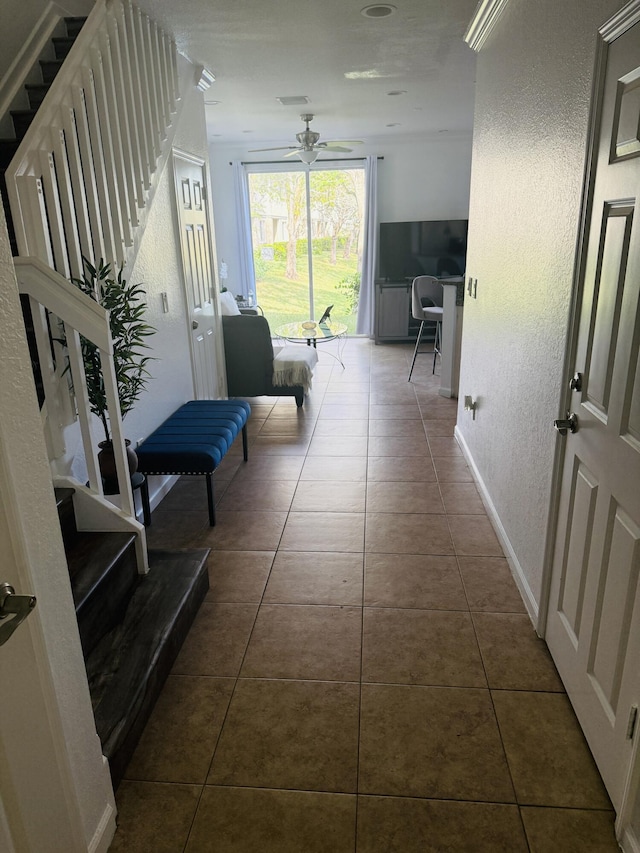 hallway featuring dark tile patterned floors