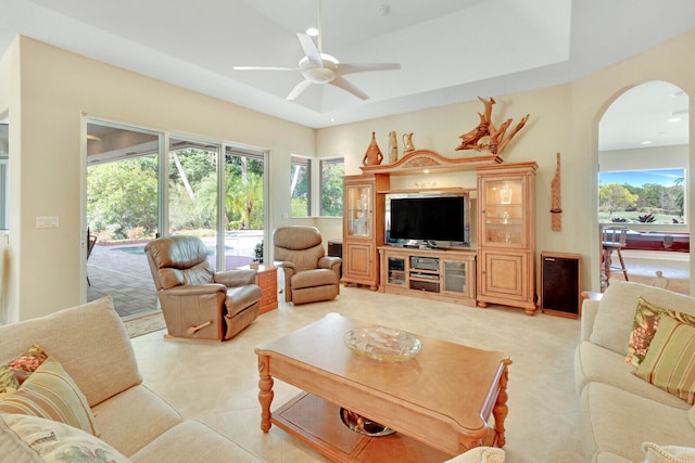 living room featuring ceiling fan and light tile patterned floors