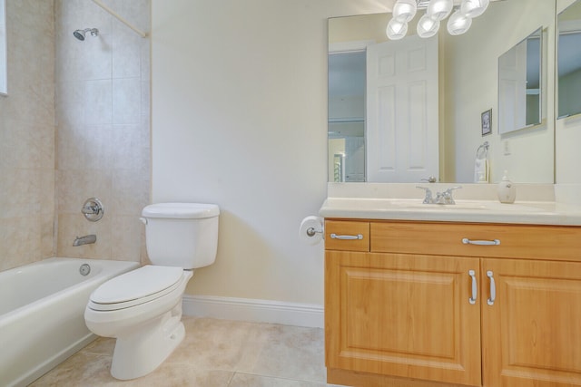 full bathroom featuring tile patterned floors, tiled shower / bath combo, toilet, and vanity