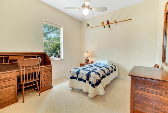 bedroom with light colored carpet and ceiling fan