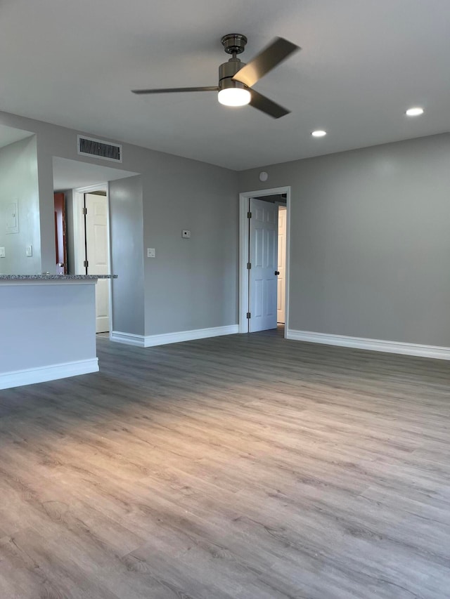 unfurnished room featuring wood-type flooring and ceiling fan