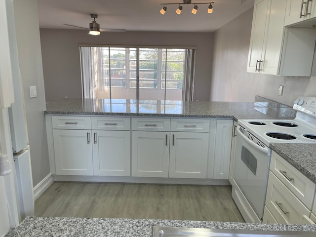 kitchen with white appliances and white cabinetry