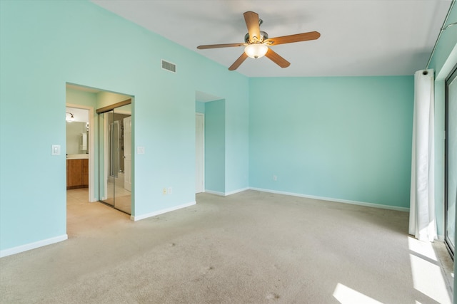 unfurnished bedroom with ceiling fan, a closet, and light carpet