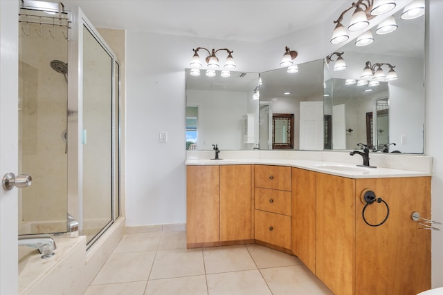 bathroom featuring tile patterned floors, vanity, and plus walk in shower