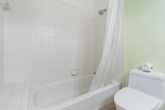 bathroom featuring toilet and shower / bathtub combination with curtain