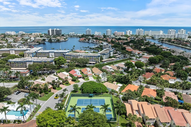 birds eye view of property with a water view