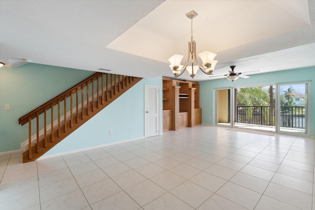 spare room with light tile patterned floors and ceiling fan with notable chandelier