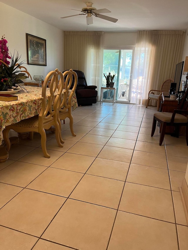 tiled dining space with ceiling fan