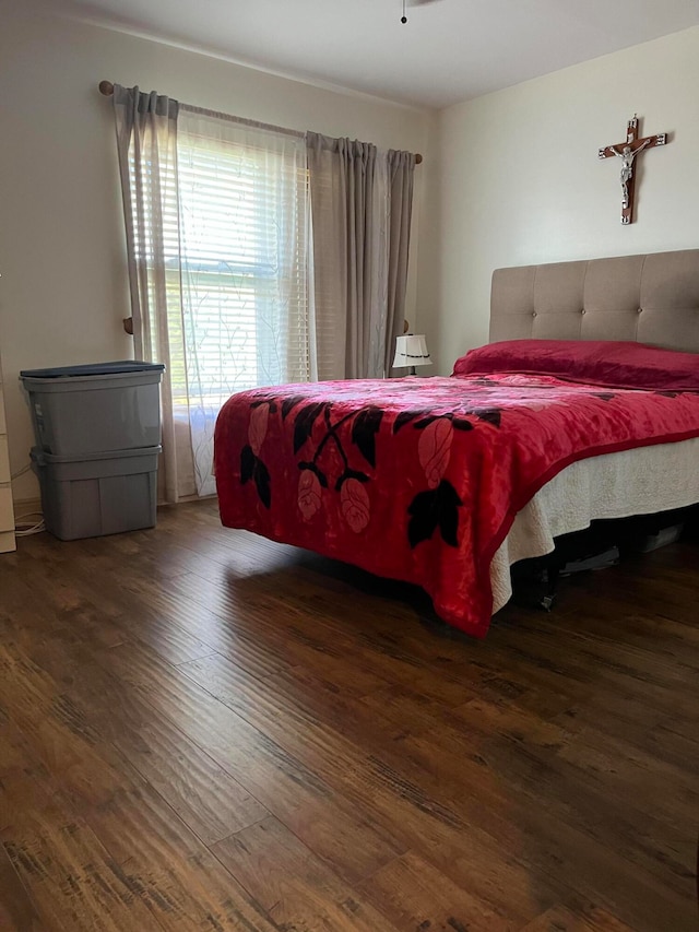 bedroom featuring dark hardwood / wood-style flooring