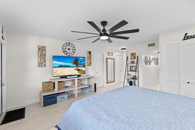 bedroom with light wood-type flooring and ceiling fan