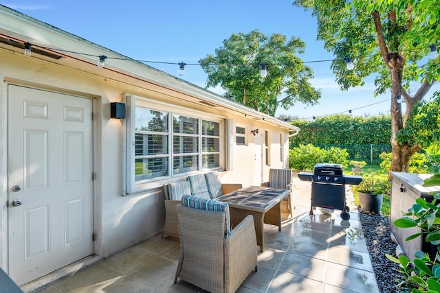 view of patio / terrace featuring outdoor lounge area and a grill