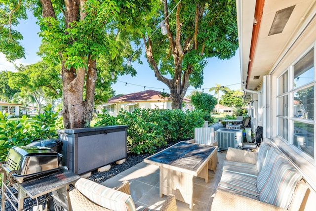 view of patio / terrace featuring cooling unit and an outdoor living space