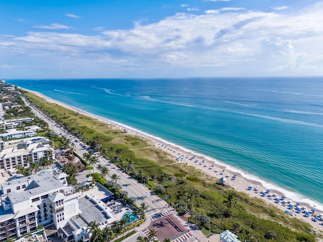 aerial view with a beach view and a water view