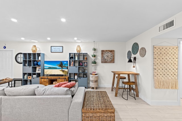 living room with light hardwood / wood-style flooring