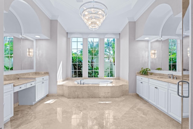 bathroom featuring vanity, tiled bath, crown molding, and an inviting chandelier