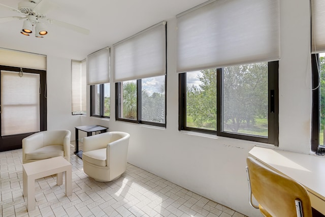 sunroom / solarium with ceiling fan and a wealth of natural light