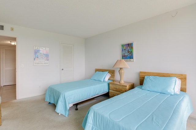 carpeted bedroom featuring a closet