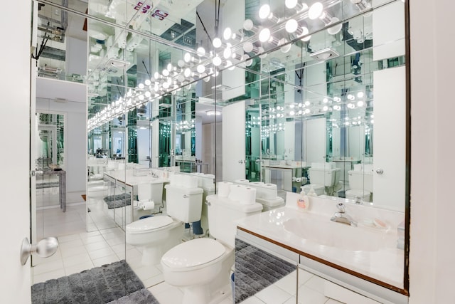 bathroom featuring tile patterned flooring, vanity, and toilet