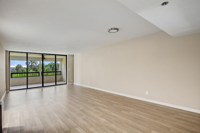 spare room featuring light wood-type flooring