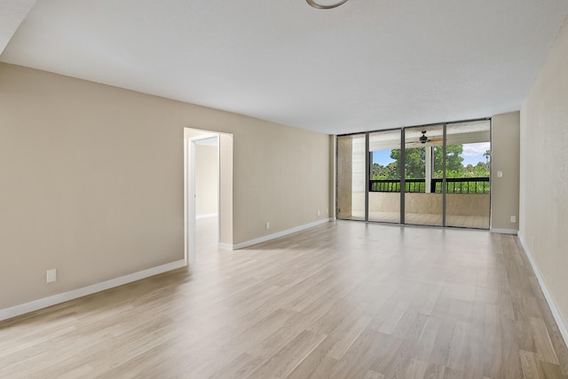 unfurnished room with light hardwood / wood-style floors