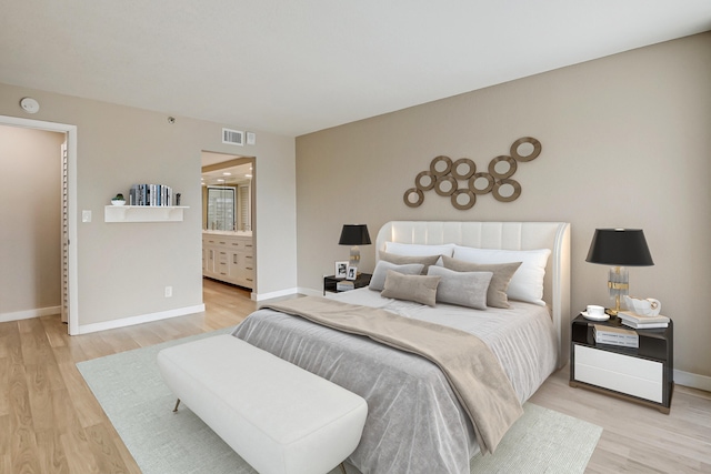 bedroom with light hardwood / wood-style floors