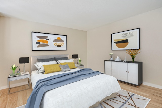 bedroom with light wood-type flooring