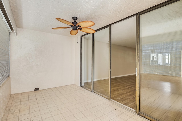 interior space featuring ceiling fan and a balcony