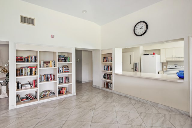 interior space featuring high vaulted ceiling