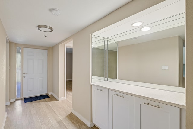 bathroom with wood-type flooring