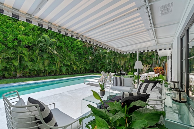 view of swimming pool featuring a patio