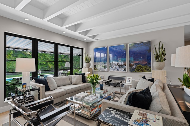 living room with hardwood / wood-style flooring and beam ceiling