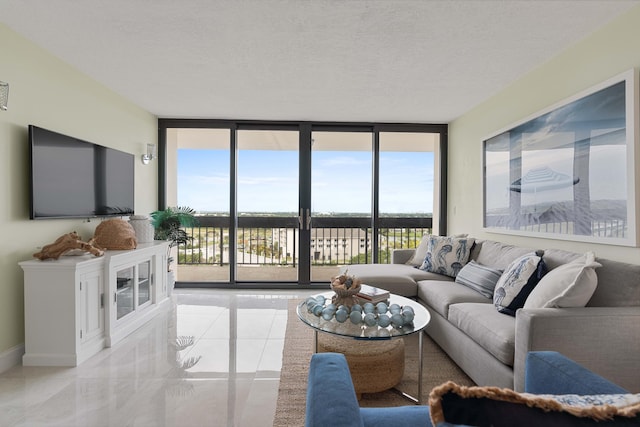 living room featuring a textured ceiling and expansive windows