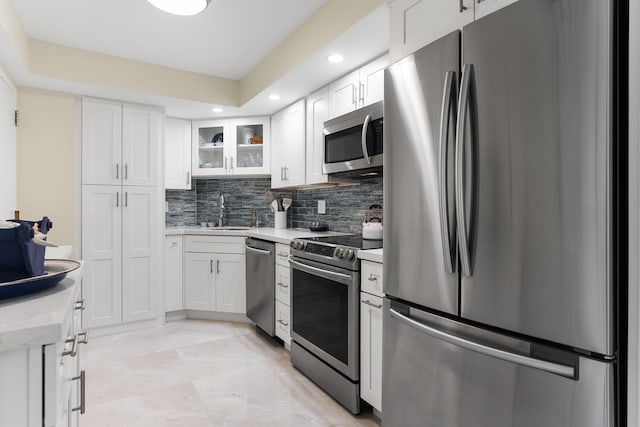 kitchen featuring white cabinetry, appliances with stainless steel finishes, and sink